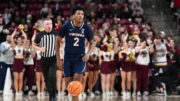 Virginia Cavaliers guard Reece Beekman (2) dribbles against the Boston College Eagles during the first half at Conte Forum.